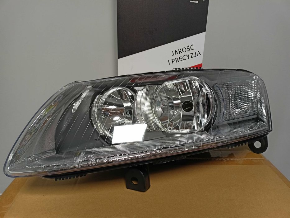 Audi A6 C6  04-10.2008 Lampa/Reflektor przód lewy /H1+H7