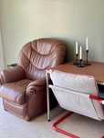 Brown genuine leather armchair with wooden details