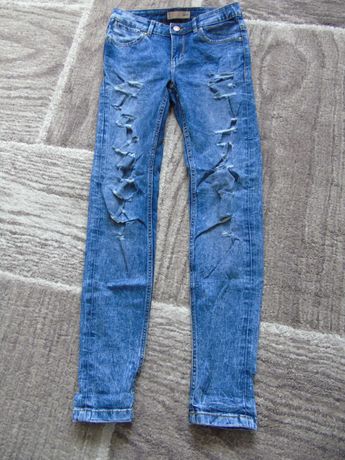 spodnie jeansy z dziurami CROPP
