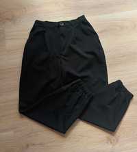 Czarne materiałowe spodnie ze ściągaczami przy dole rozmiar S