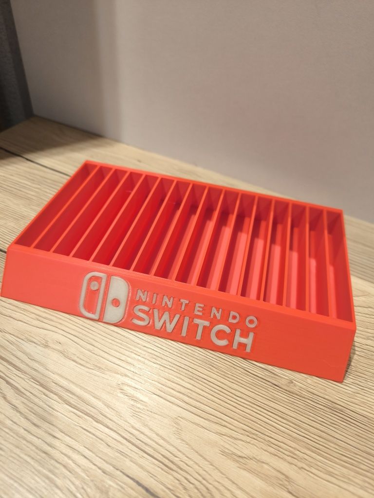 Stojak podstawka na gry Nintendo Switch napis fluorescencyjny