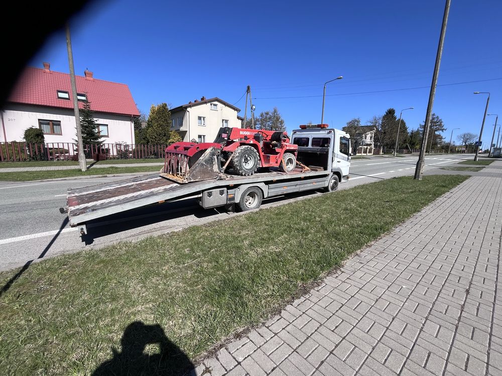 Pomoc drogowa. Autolaweta.Usługi transportowe.