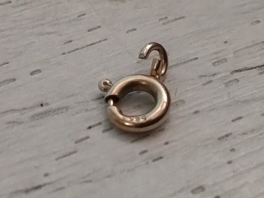 Золотий замочок від ланцюжка (585*0.13грм.).