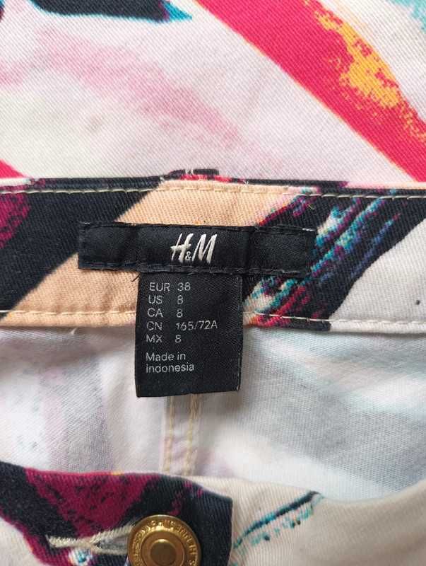 Kolorowe spodnie H&M z abstrakcyjnym wzorem - rozmiar 38