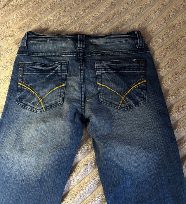 Вінтажні Джинси кльош з низ. посадкою розмір с