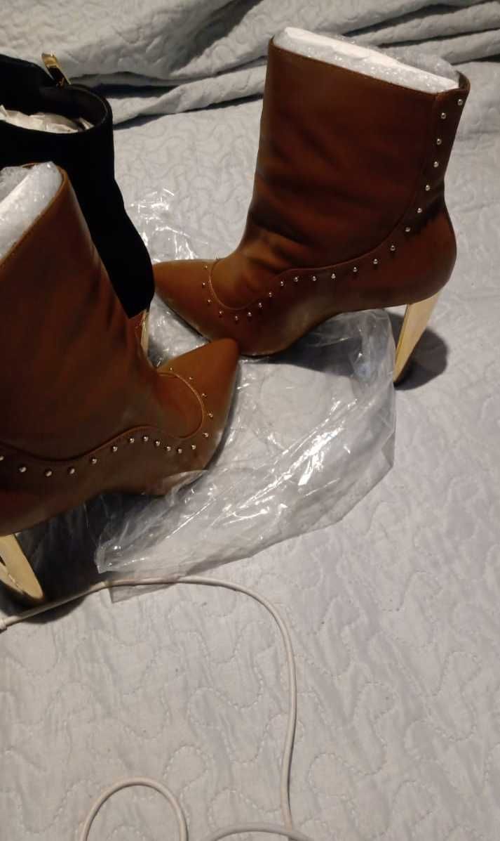 Super Promoção,70 porcento de desconto,lindas botas compre agora.