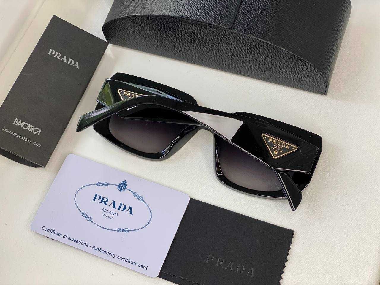 Солнцезащитные очки Prada.
