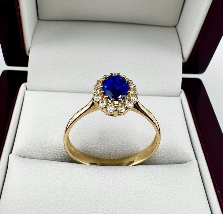 Złoty pierścionek z granatowym oczkiem 2,42g 585 14K R. 20