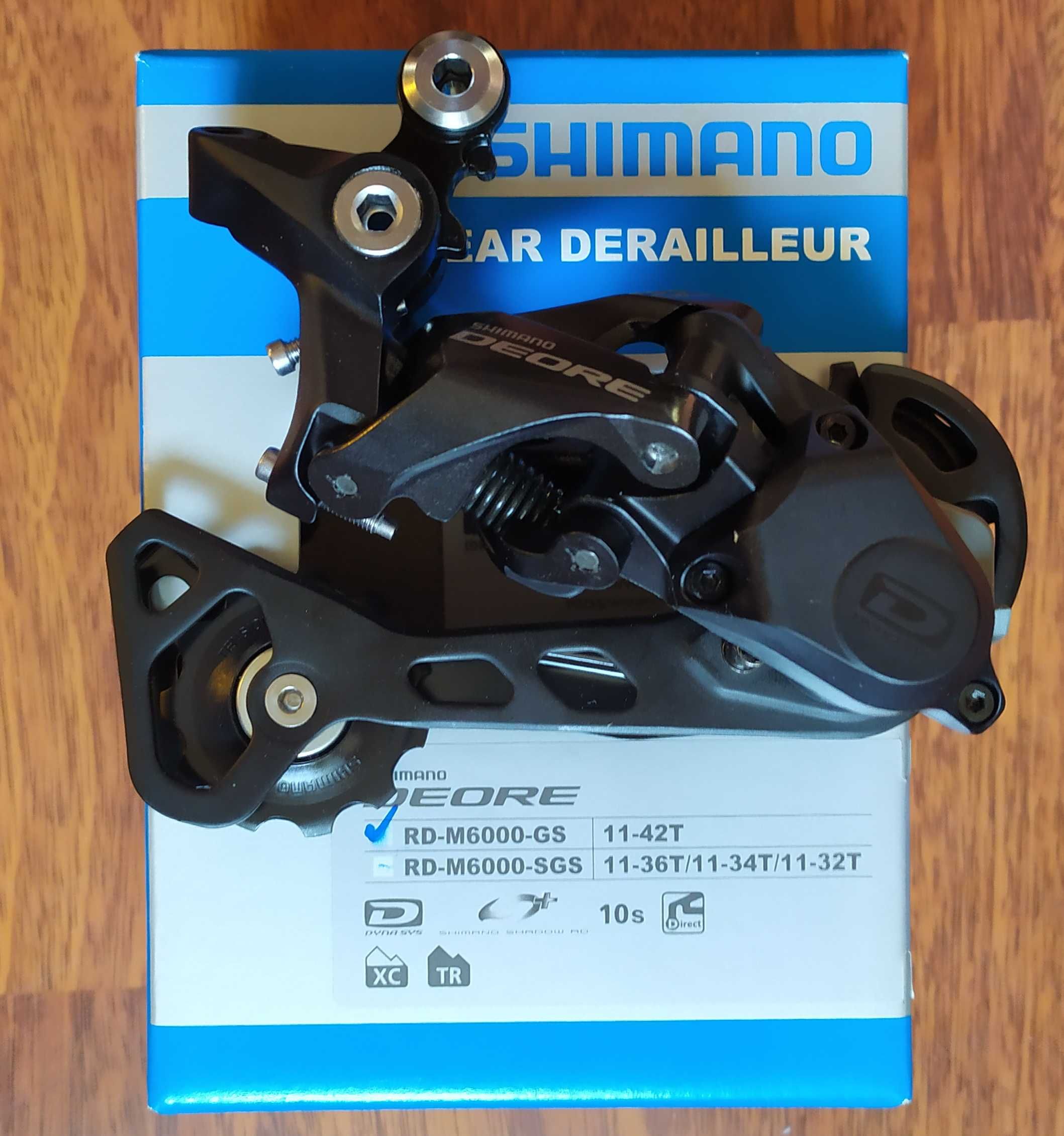 Задній перемикач Shimano Deore; SLX;(ХТ) 7--12 швидкостей