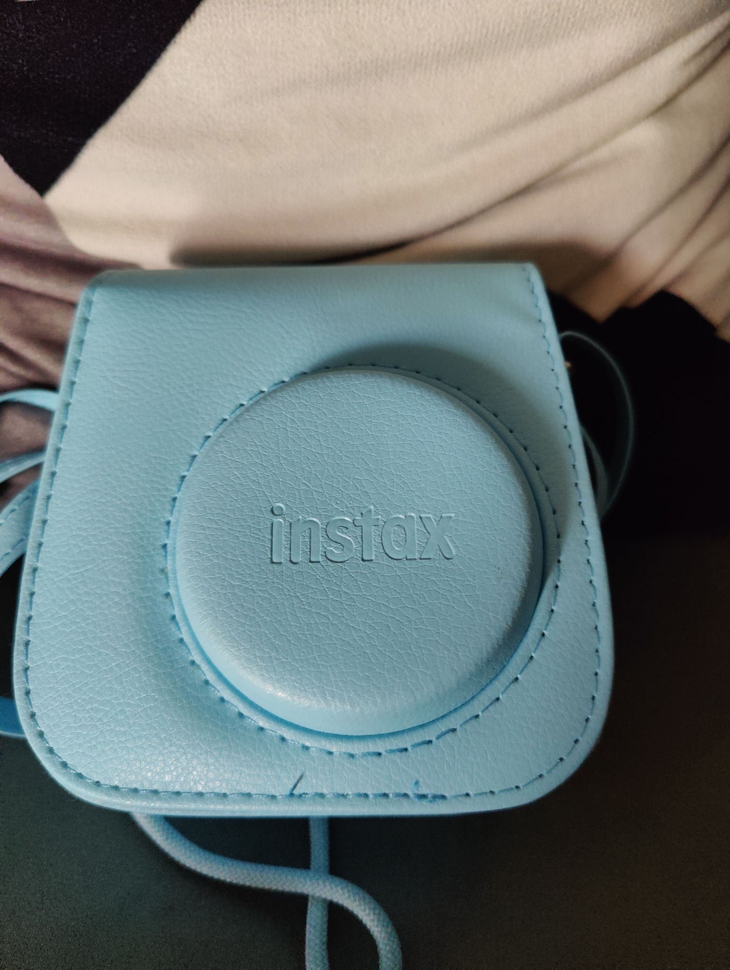 Máquina fotográfica instax