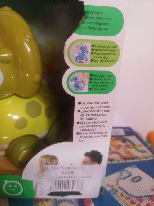 Каталка-динозаврик електронна Hola Toys музична 18х12 см з підсвічуван