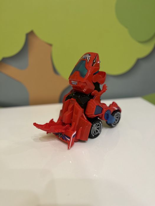 Музична машинка трасформер Динобот динозавр