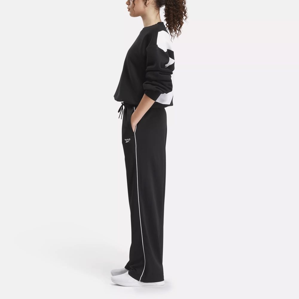 Жіночі спортивні штани reebok identity back vector