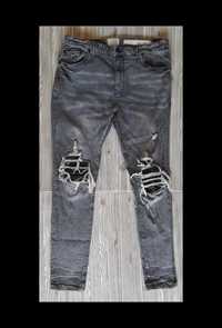 Włoskie spodnie jeansy z przetarciami o wąskim kroju premium Amicci