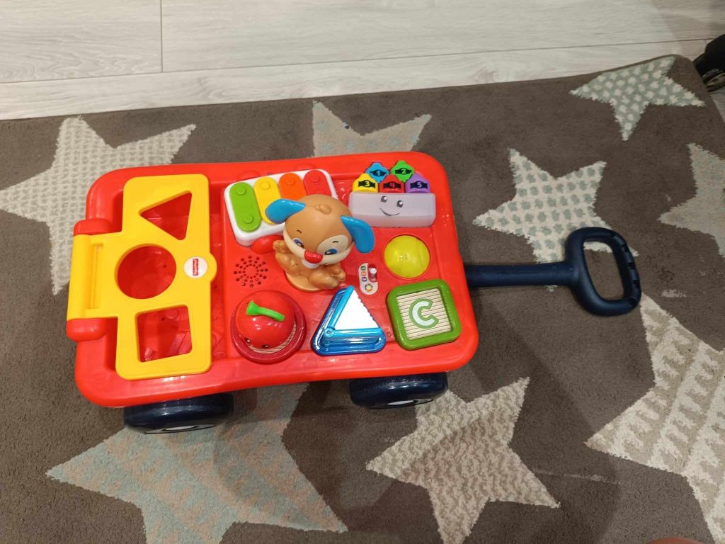 Edukacyjny wózek szczeniaczka Fisher Price 
UŻYWANY Wózek Szczen