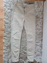 Kremowe spodnie rurki Sinsay xxs