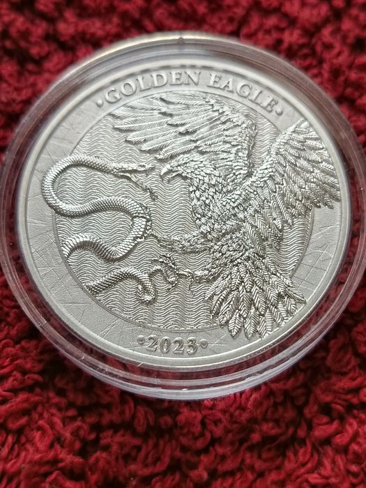 Срібна монета золотий орел