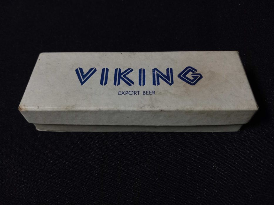 Publicidade - Tira caricas cabo em prata da Viking Beer