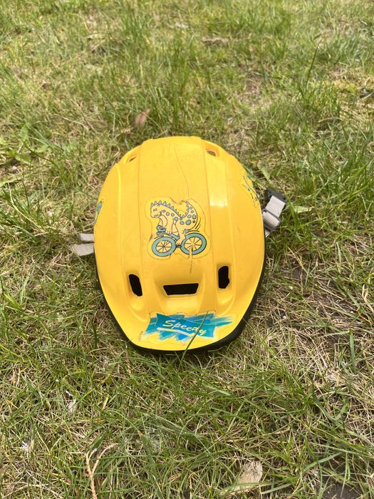 Kask na rower dla dziecka 46, żółty z dinozaurem