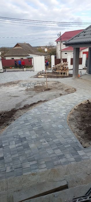 Укладання тротуарної плитки.Укладка тротуарной плитки.