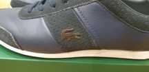 Sapatos Lacoste.