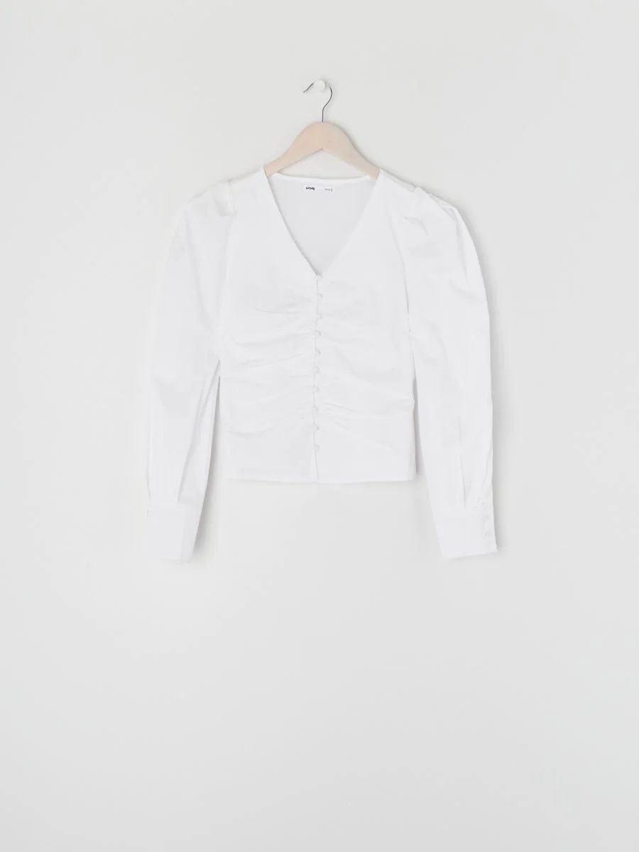 Біла блузка з об'ємними рукавами