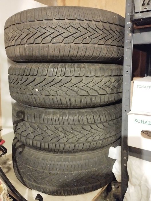 Koła zimowe kompletne z czujnikami i kołpakami 185/65 R15 Nissan