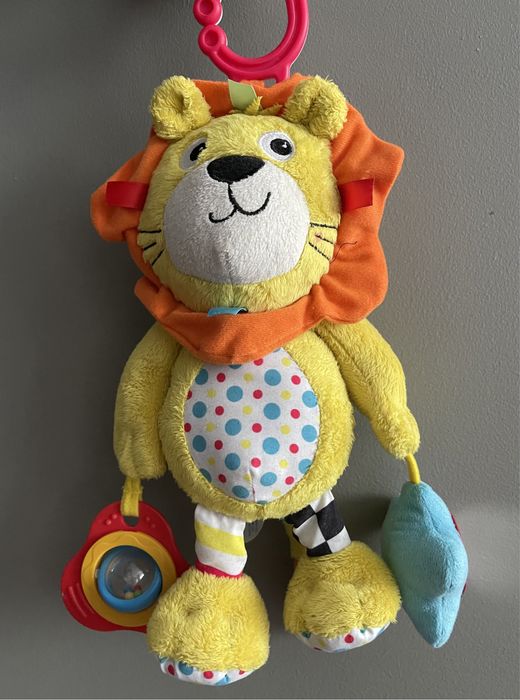 Zabawka niemowlęca zawieszka do wózka lew Carousel grzechotka wibruje