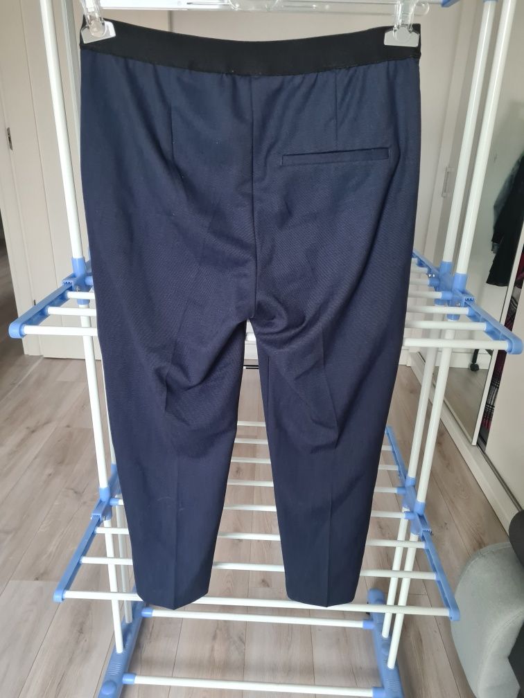 Eleganckie spodnie marki H&M. Rozmiar 38.