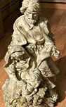Escultura talhada em dourado representativa do presépio
