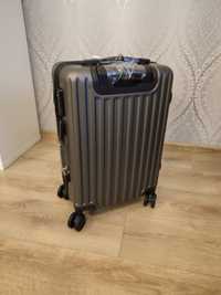 Nowa szara walizka podróżna