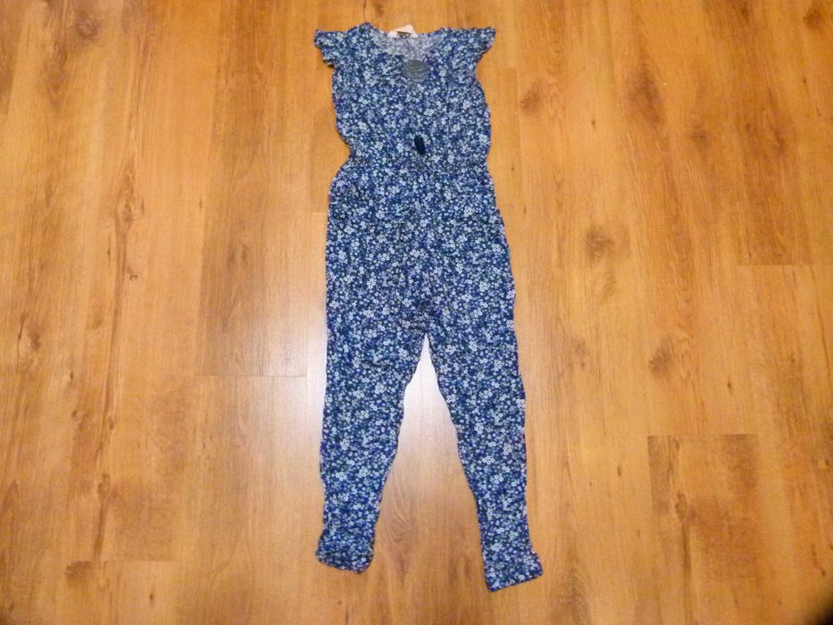 rozm 134 H&M kombinezon granatowy kwiatuszki długa nogawka