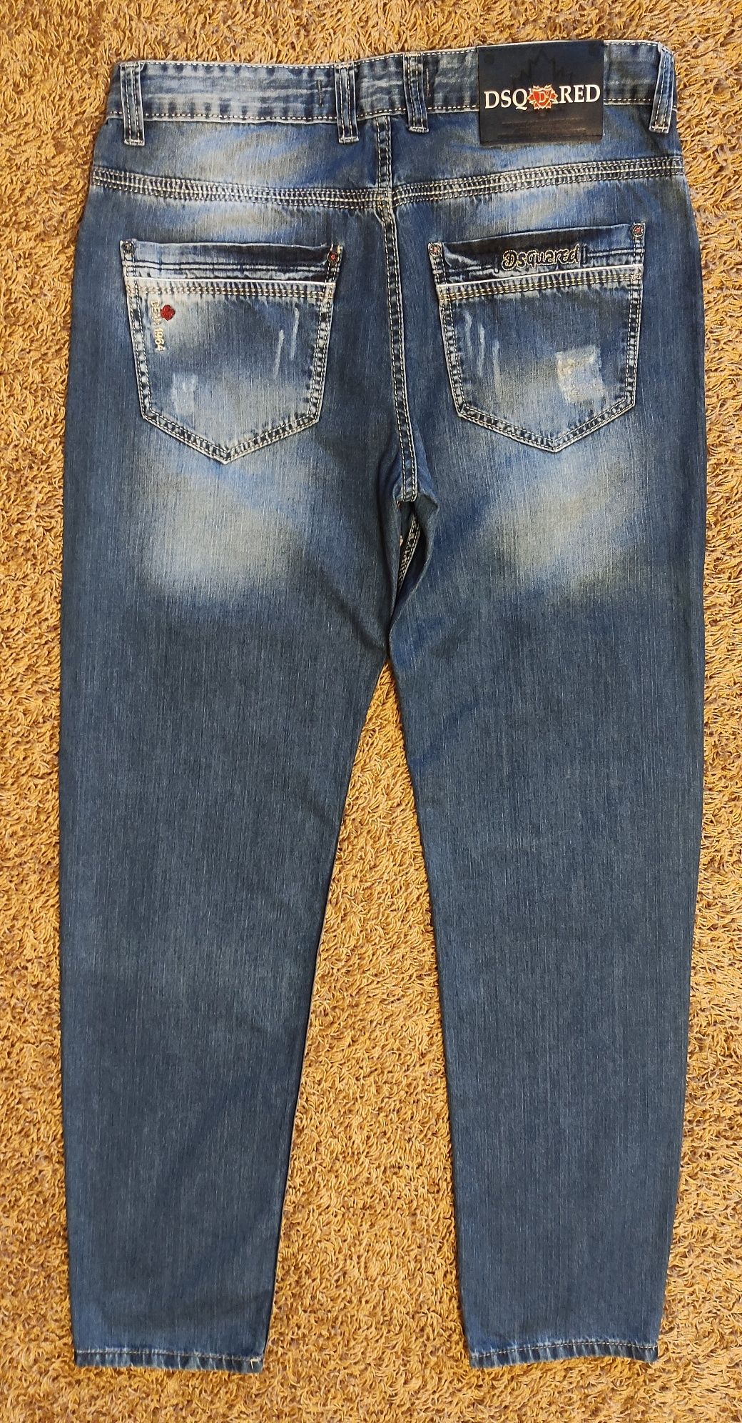 Dsquared2 świetne spodnie jeansowe z dziurami  L