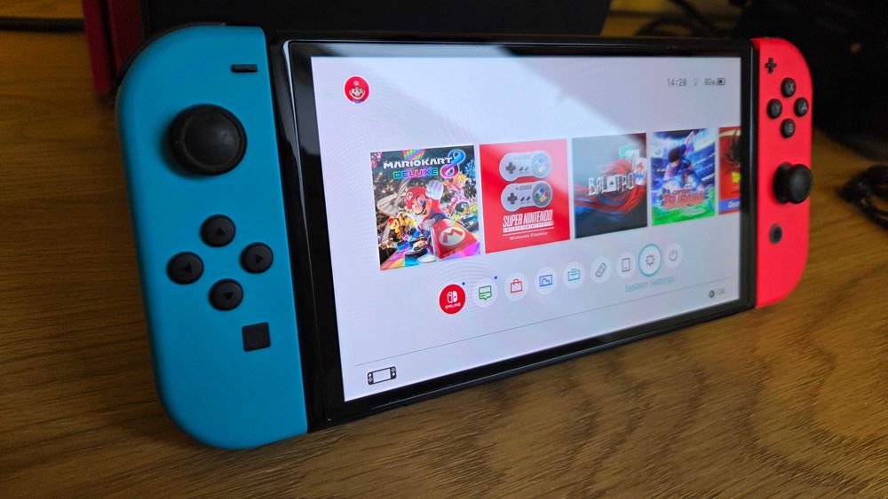 Nintendo Switch 1 OLED niebiesko-czerwony stan bdb+ mało używana