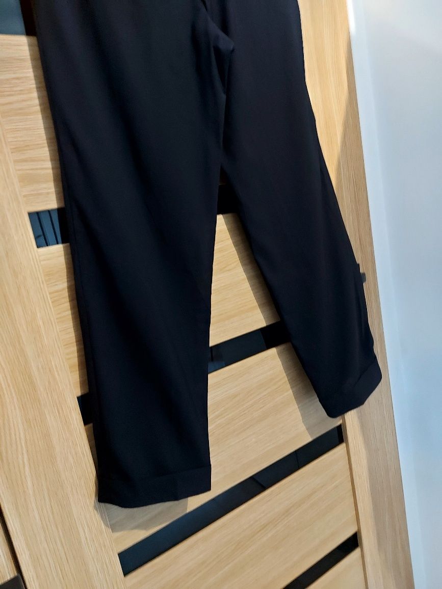 Hugo Boss męskie eleganckie spodnie na kant wełna roz  L