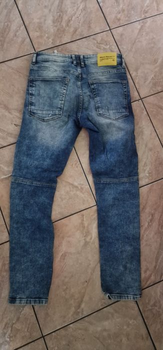 Super modne spodnie z przedarciami rozmiar 30