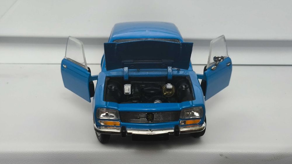 Модель, машинка Peugeot 504 1975 1.24 Welly