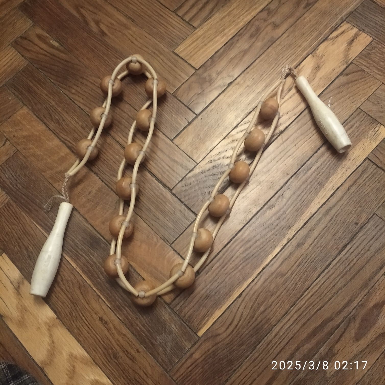 Ручний роликовий масажер.