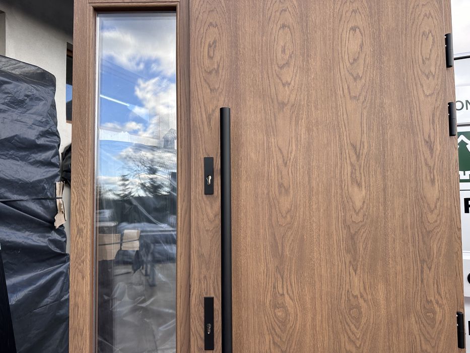 Drzwi zewnętrzne drewniane dębowe z doświetlem i antabą montaz Polska