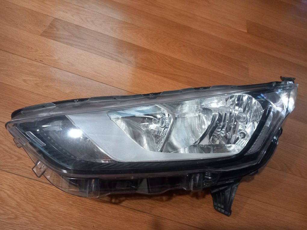 Farol optica frente esquerda Ford Transit Connect do ano 2018 a 2025.