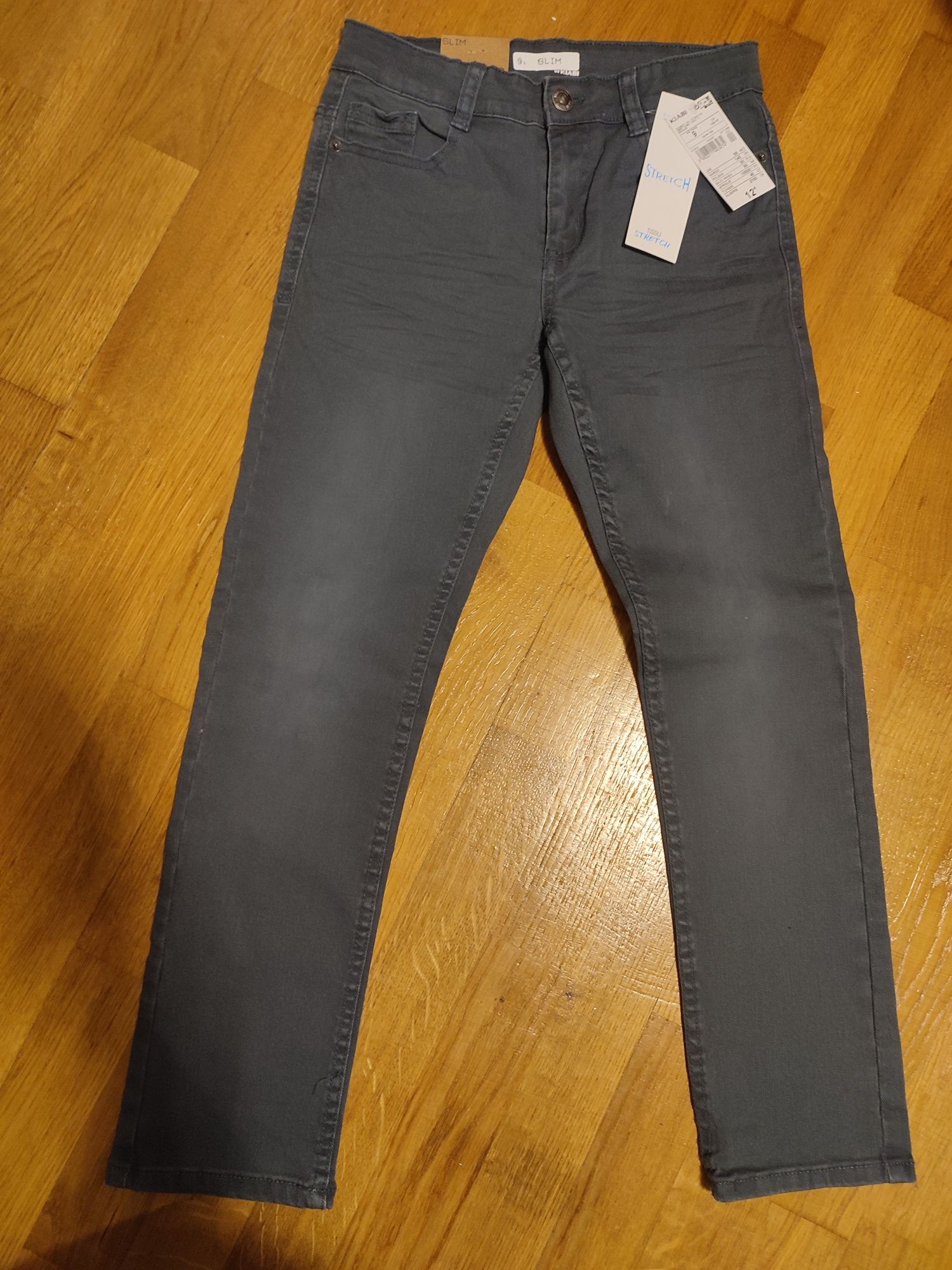 Kiabi spodnie eleganckie szare dżinsy slim stretch r. 134 nowe
