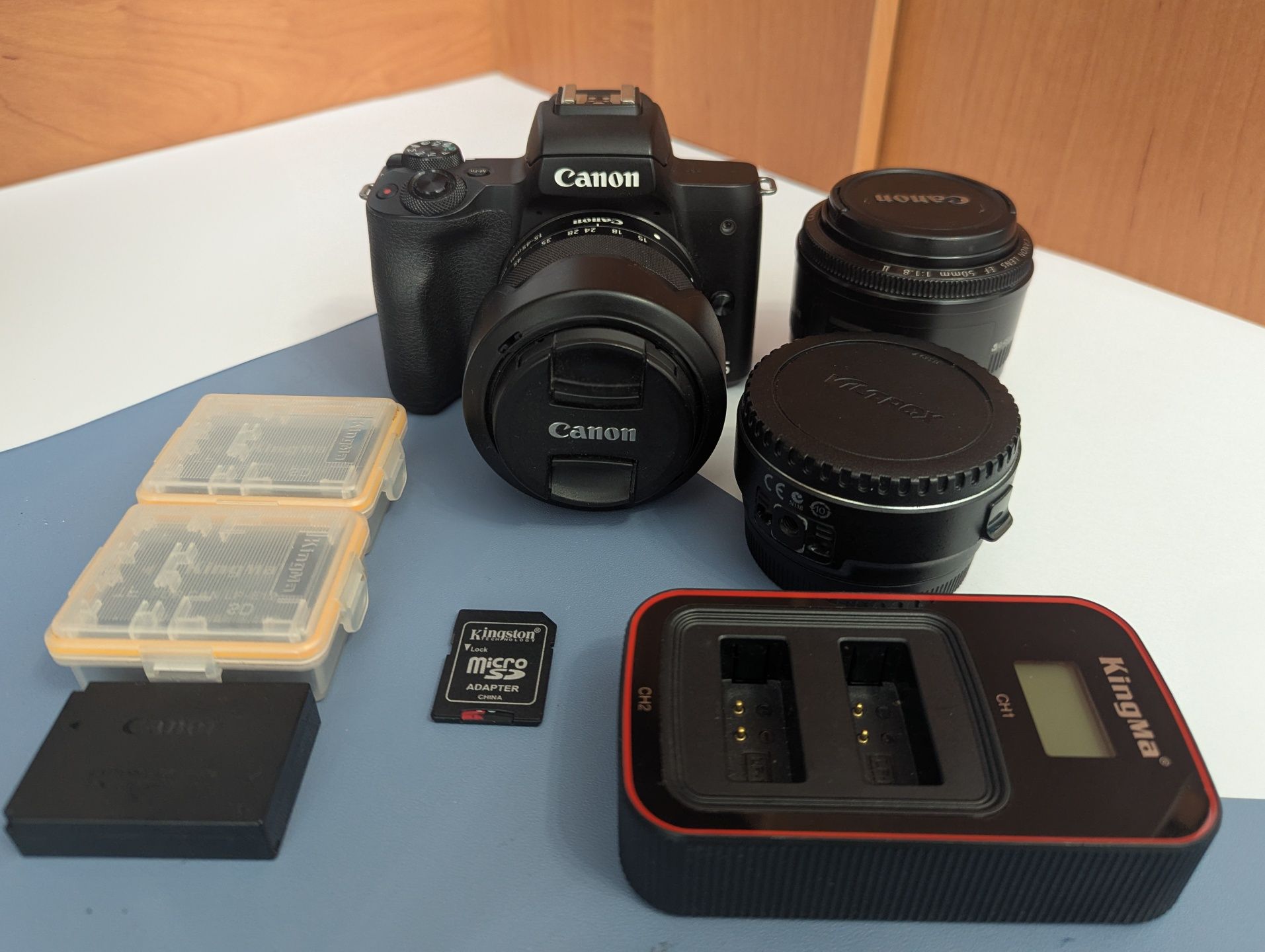 Canon m50 + Kit 15-45 + 50mm 1.8
-canon EF 50mm f/1.8