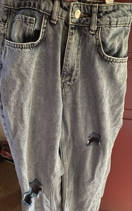 Calças de ganga rasgadas