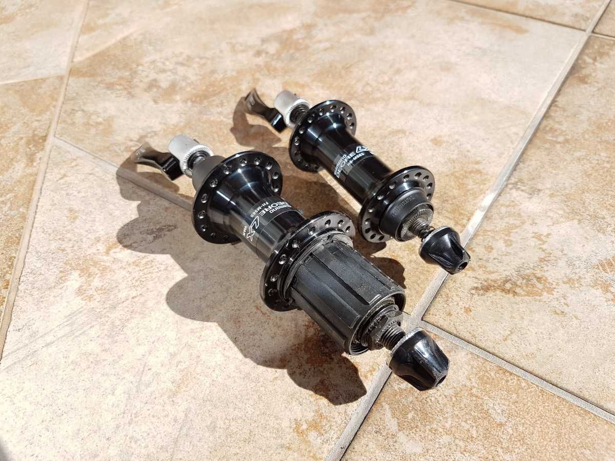 piasty Shimano DEORE LX, FH-M565, HB-M563, 32H + zaciski, stan BDB