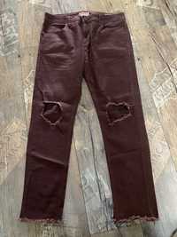 Spodnie jeans Castro z rozdarciem  rozmiar 32/L