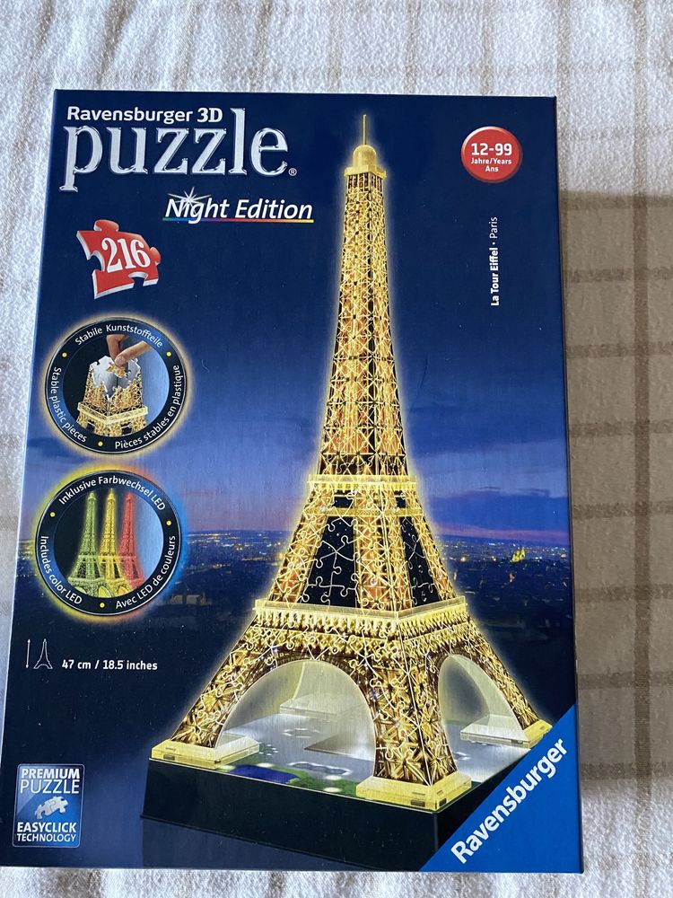 Puzzle para construir a torre Eiffel iluminada