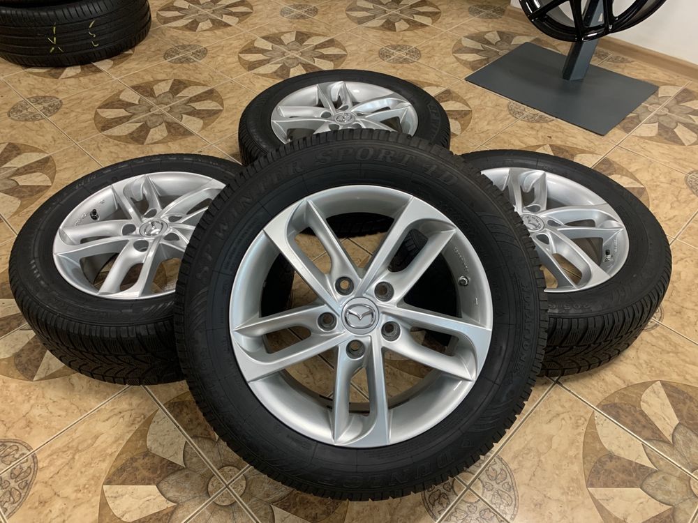 Комплект дисків R16 5/114.3 ET55 6.5JJ*16FH з шинами 205/60/16 DUNLOP