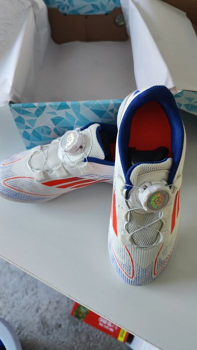 Chuteiras de relva sintética