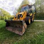 Usługi koparko-ładowarką JCB CX3, przyłącza, fundamenty, odwodnienia.