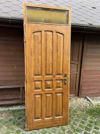 Drzwi zewnętrzne drewniane z naświetlem, rama 91 cm x 240 cm.